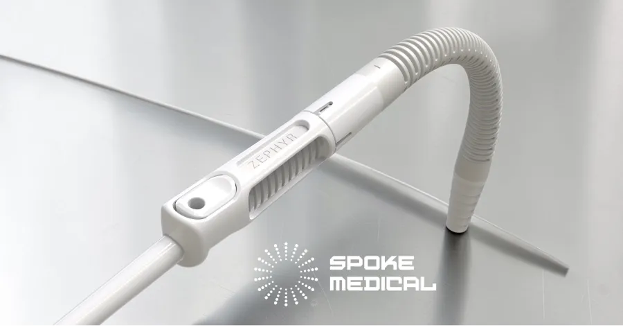 Zephyr's flexible suction tubing bent into an arc on a steel surgical surface