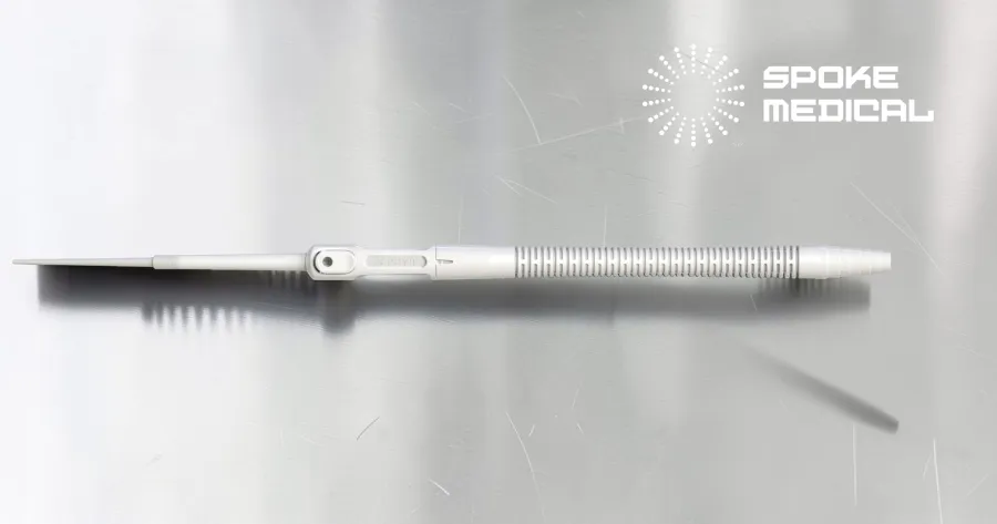 Full side profile of the Zephyr microsuction handpiece on brushed steel