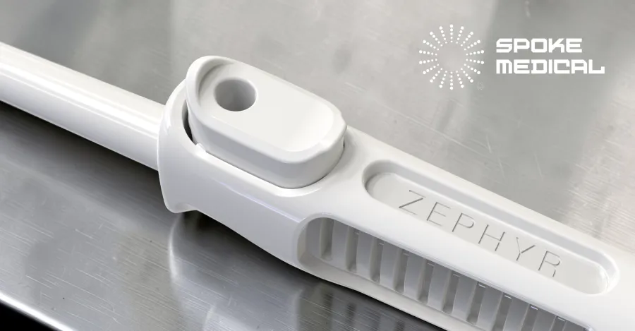 Close-up of the Zephyr thumb-port suction control and ZEPHYR engraving on steel